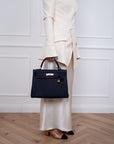 Hermès Kelly 32 Retourne aus Togo Leder