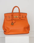 Hermès HAC 40 Retourne aus Clemence Leder mit gelbgoldenen gebürsteten Beschlägen in Orange