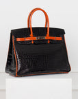 Hermès Birkin Limited Edition aus Alligator Leder mit Palladium Beschlägen in Noir/Orange