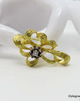 Brosche mit ca. 0,15ct TW-vs Brillant in 750/18K Weiß-/Gelbgold