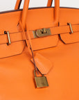 Hermès HAC 40 Retourne aus Clemence Leder mit gelbgoldenen gebürsteten Beschlägen in Orange