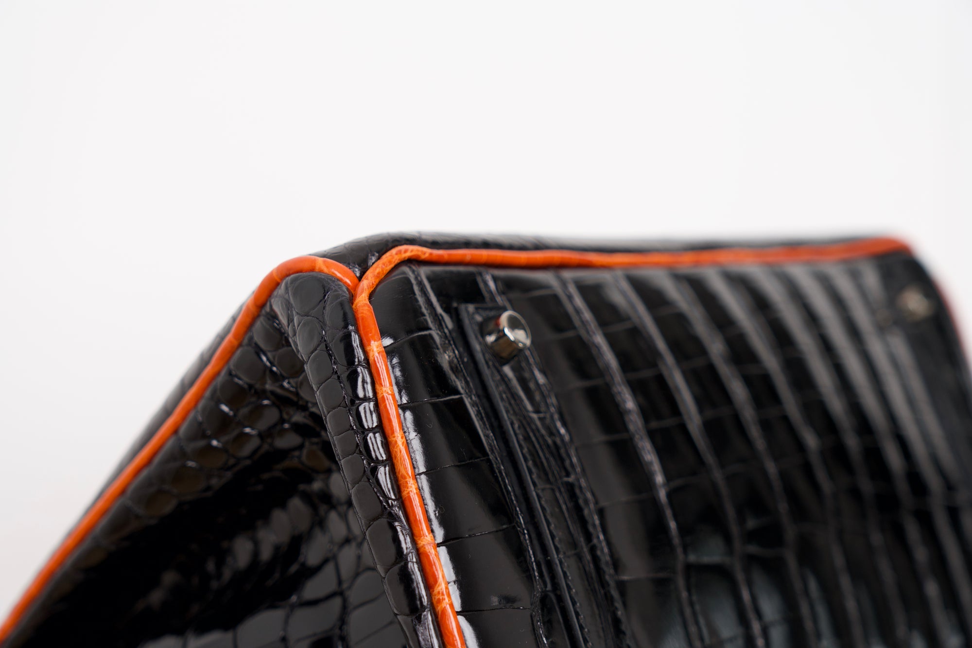 Hermès Birkin Limited Edition aus Alligator Leder mit Palladium Beschlägen in Noir/Orange