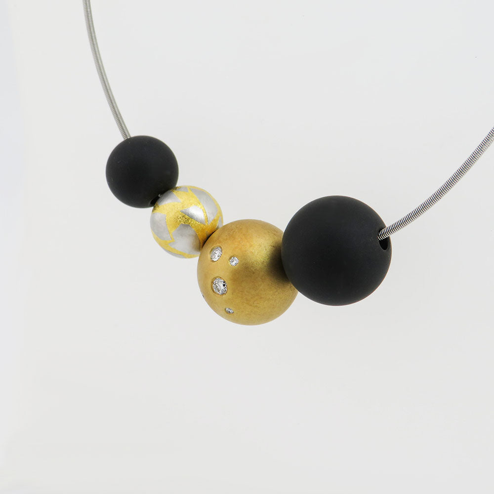 Niessing Schnur mit Kugeln und Brillant in 950`er Platin/18K Gold ca. 43,0 cm